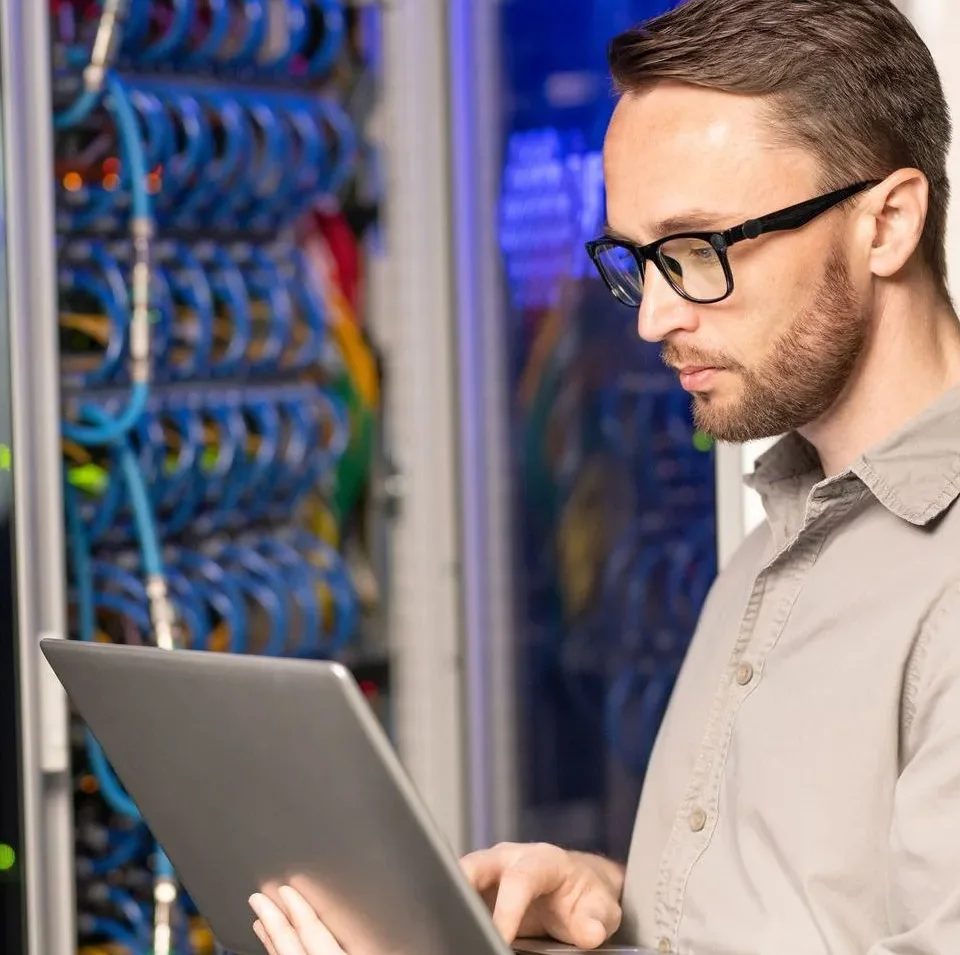 Technician installing network equipment